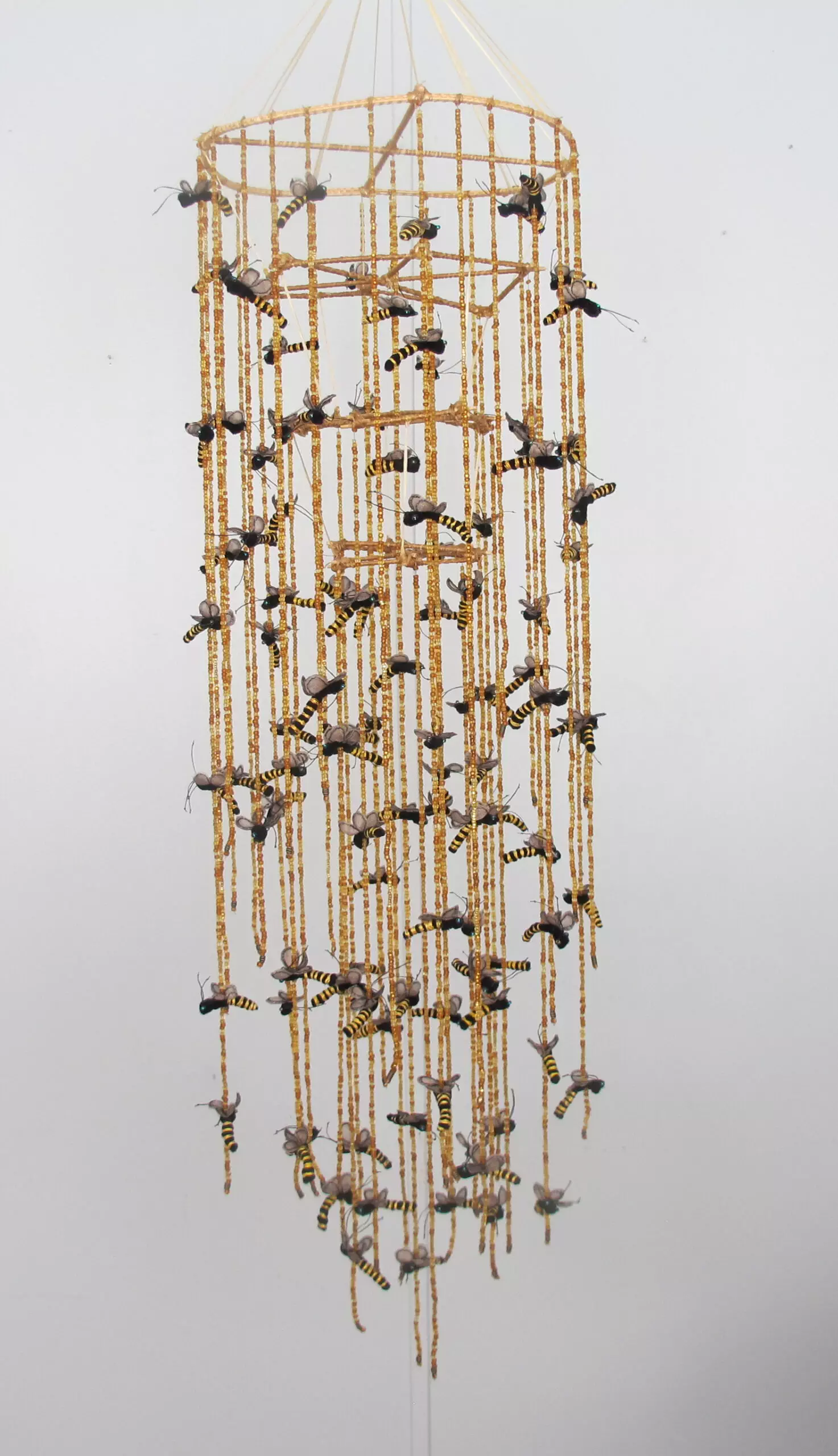 Swarm beads, waxed fiber, wool felt, bamboo 48H x 12W x 12D 2021 Collection of Bret Boulter